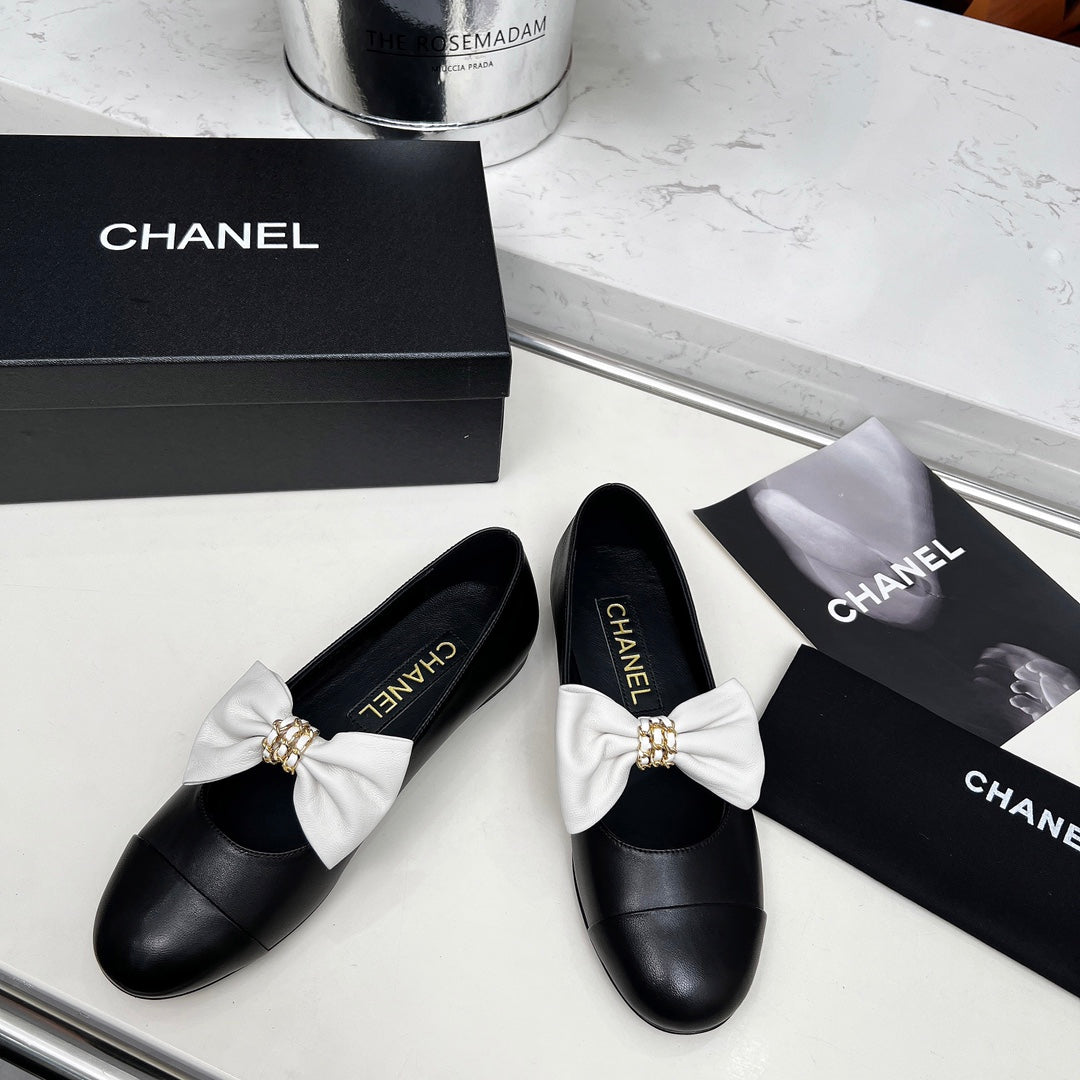 CHANEL 25S MARY JANES IN BLACK CALFSKIN WITH WHITE BOW GOLD HARDWARE