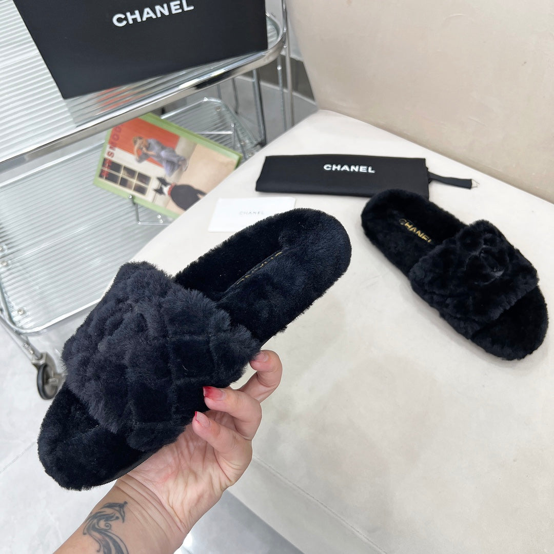 CHANEL 25S FUR SLIPPERS WITH EXPOSED-STITCH STRAPS IN BLACK